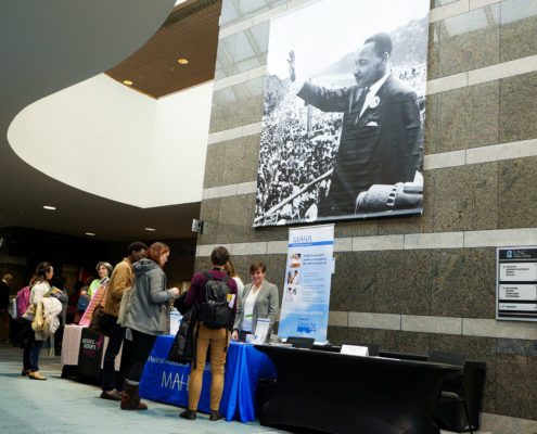 Atrium with Martin Luther King Jr. banner and line for information.