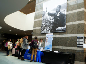 Atrium with Martin Luther King Jr. banner and line for information.